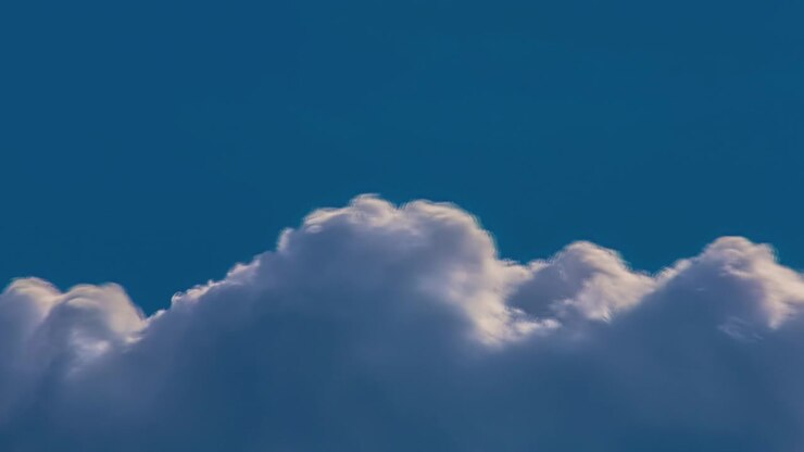 Fluffy cloud forming and dissipating - sky only cloudscape time lapse