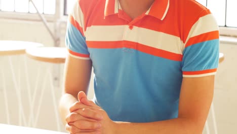 Thoughtful-man-sitting-with-cup-of-coffee