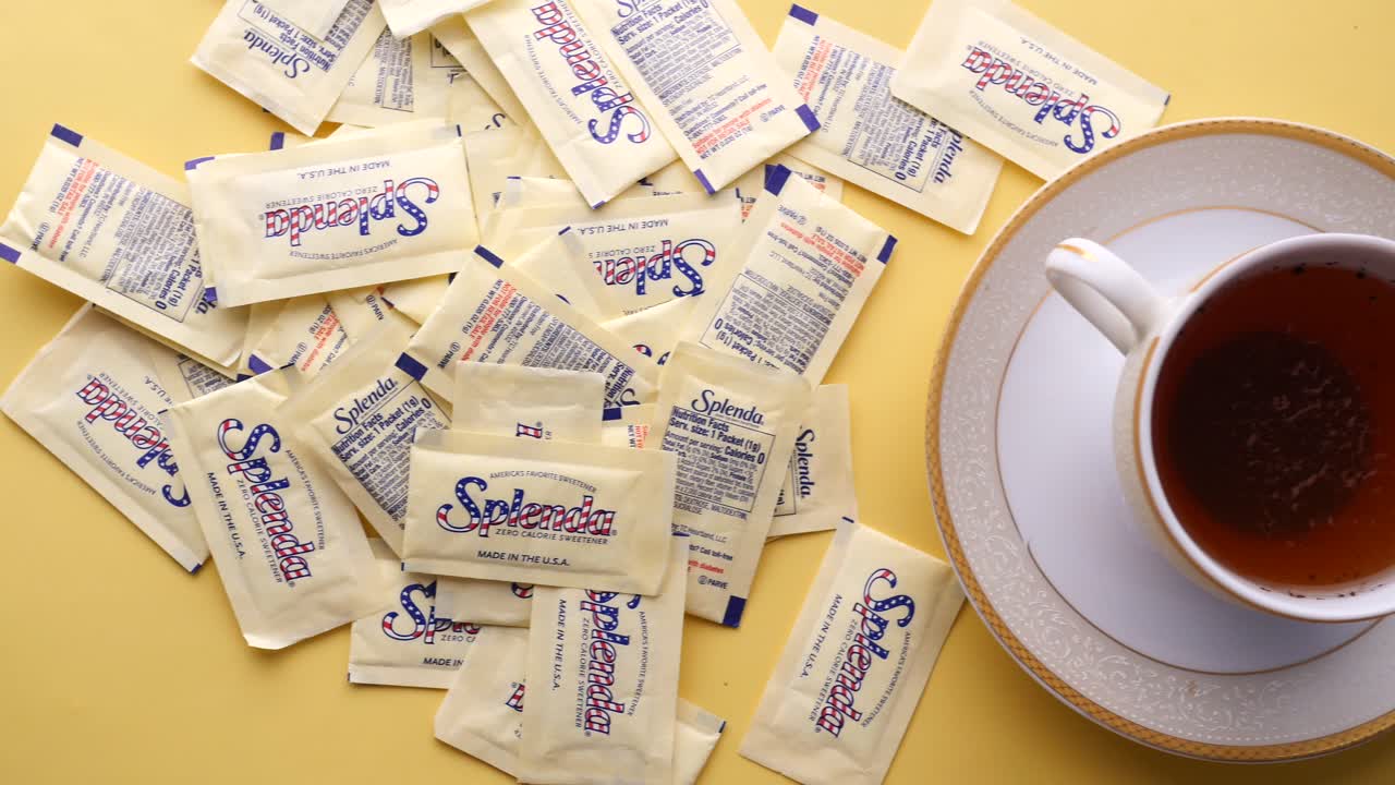 Splenda Sweetener Packets and Cup of Tea