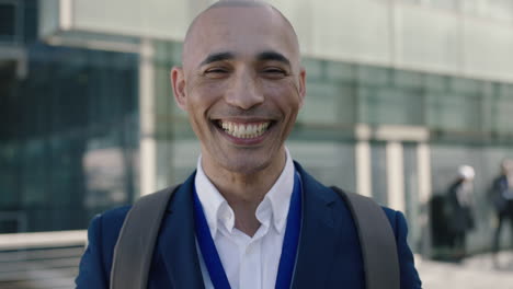close-up-portrait-of-bald-hispanic-businessman-looking-laughing-at-camera-corporate-business