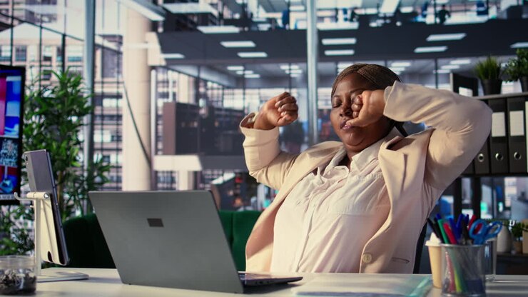 Tired businesswoman in office