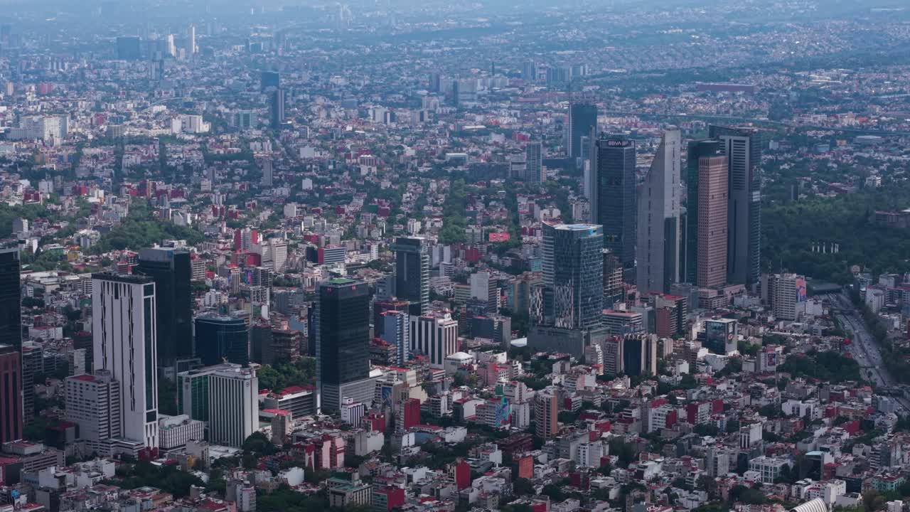 Drone footage from high up, showing skyscrapers on Reforma in CDMX