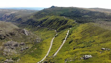 enchanted valley intersected by a road in serra da estrela