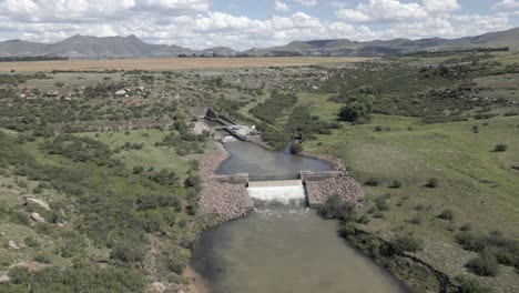 River-pours-over-river-weir-at-hydro-dam-underground-pipeline-outfall