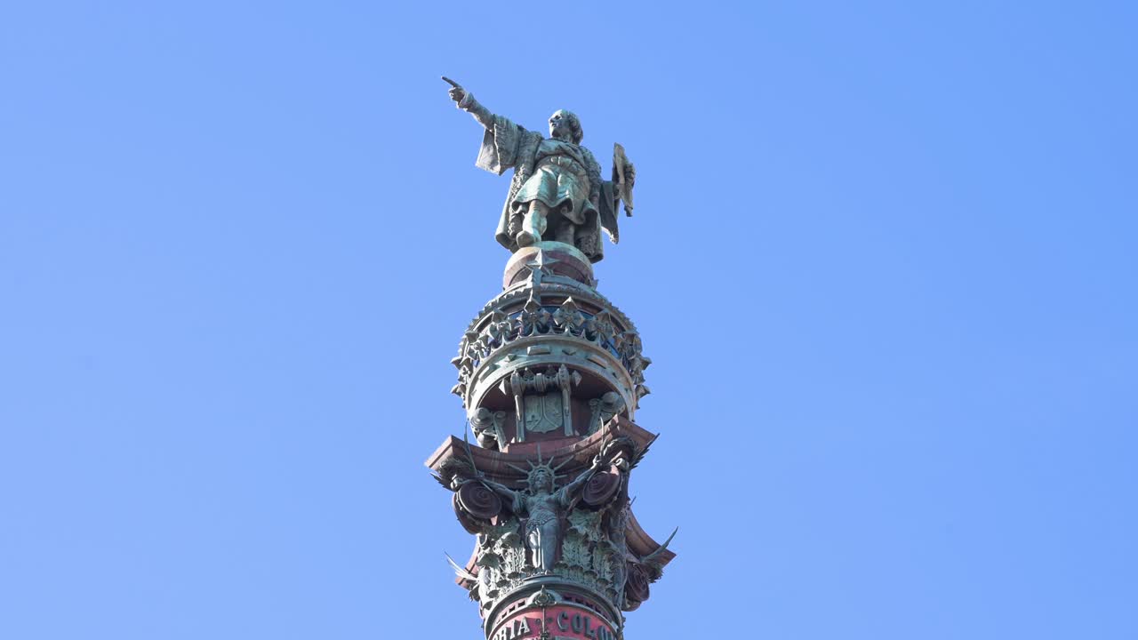 At Port Vell in Barcelona, the bronze statue of Christopher Columbus points commandingly. This detailed, low-angle shot captures the famous monument dedicated to the celebrated explorer's journey