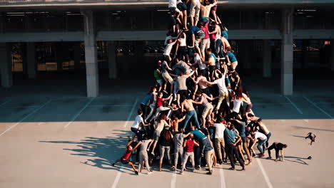 human pyramid in parking lot