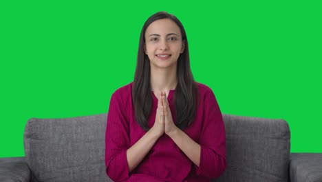 happy indian woman waving doing namaste green screen