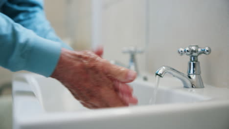 washing hands in sink