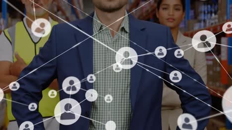 animation of network of connections with icons and shapes over diverse workers in warehouse