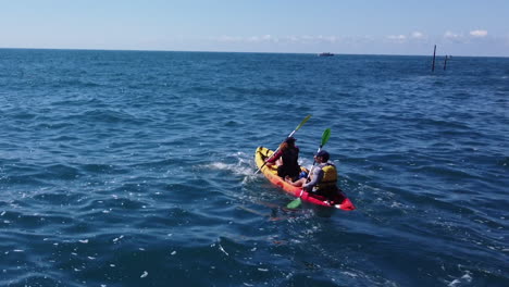 couple kayaking on the ocean