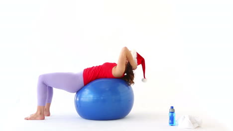 Fit-festive-brunette-working-out-in-santa-hat