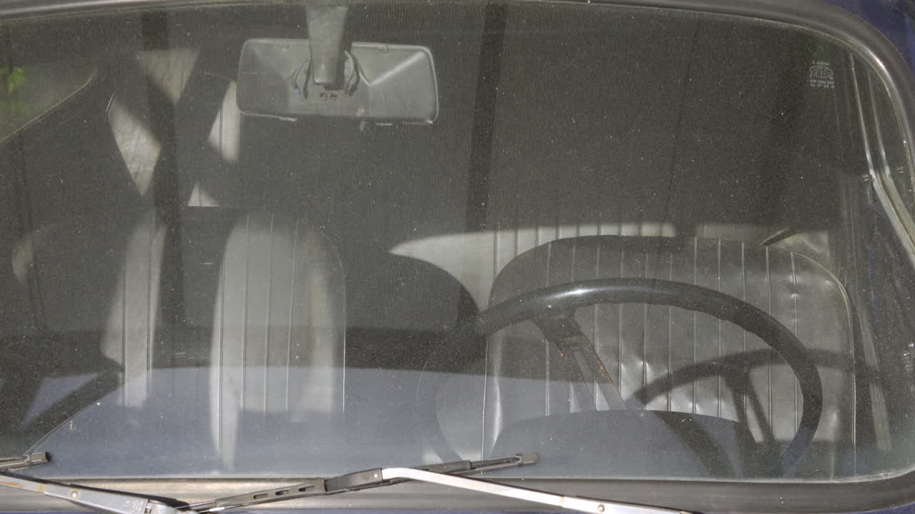 Antibes, France - May 9, 2025: View of the inside of an old car from the windshield