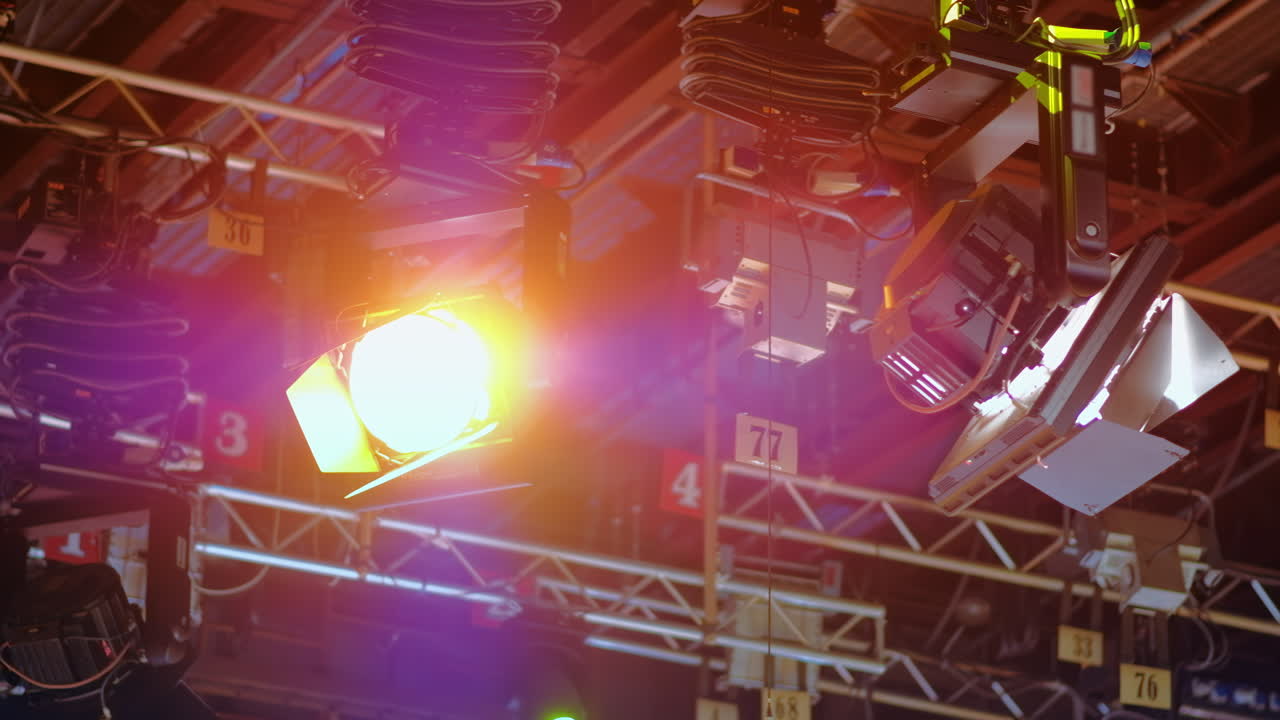 Flashing studio lights equipment on the ceiling of a TV set