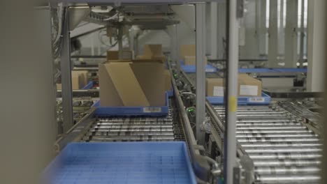 boxes on a conveyor belt in an automated warehouse system