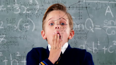 animation of math formulas over scared caucasian boy over blackboard