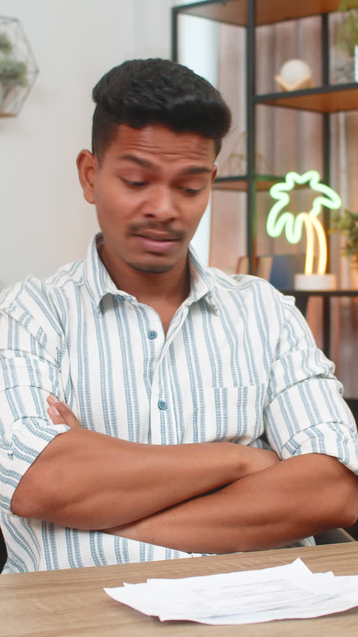 Indian man reacts to receipt error throws papers aside breathes steady plans fix with support call