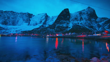 Cinematic-slow-pan-to-reveal-waterside-homes-in-Reine,-Norway