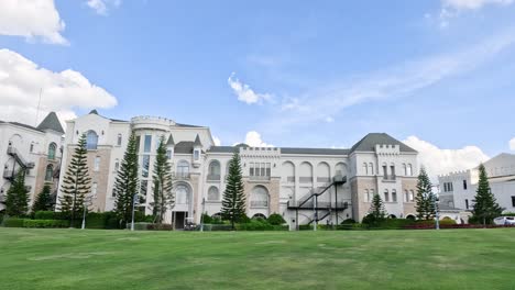 time-lapse of clouds over grand architecture.