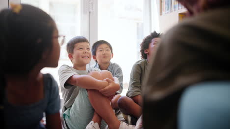 children listening to a story in a classroom