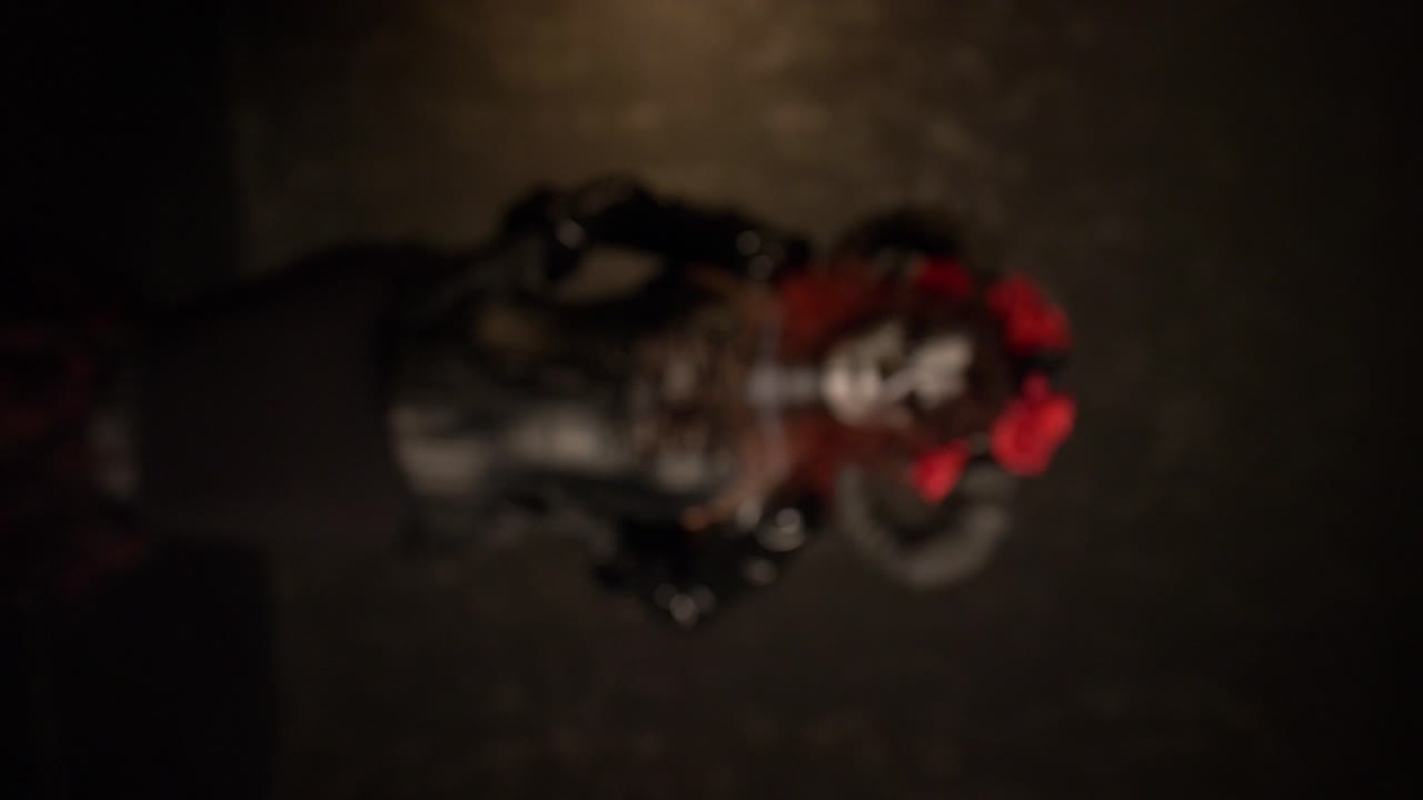 Catrina Cosplay girl moving hands slowly caressing her body with Domina outfit and Dark background , Medium Close up