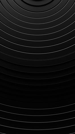 black background with circular pattern of lines and white circle. vertical looped animation