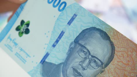 close up of the newest 2022 edition 50000 or fifty thousand rupiah bank note