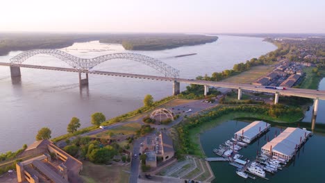 good aerial over a barge on the mississippi river with hernando de soto bridge foreground