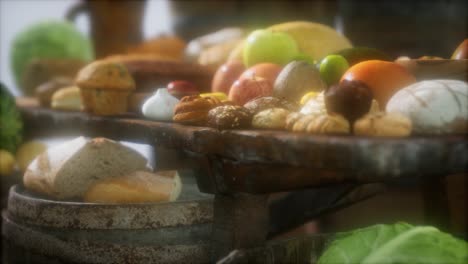 food table with wine barrels and some fruits, vegetables and bread