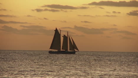 a beautiful sailing ship at sunset