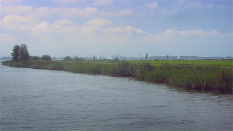 pastoral countryside with sail boats