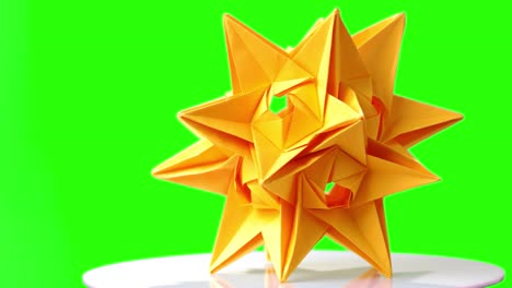 spiky origami model on green screen.