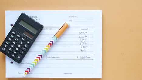 a man writes payment due in a paper form