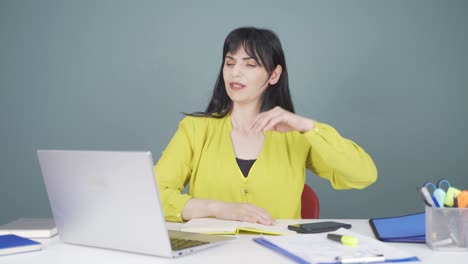 woman working on laptop has a headache.