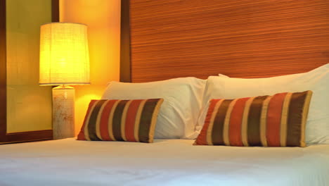Pan-across-a-stylish-bedroom-in-a-resort-hotel