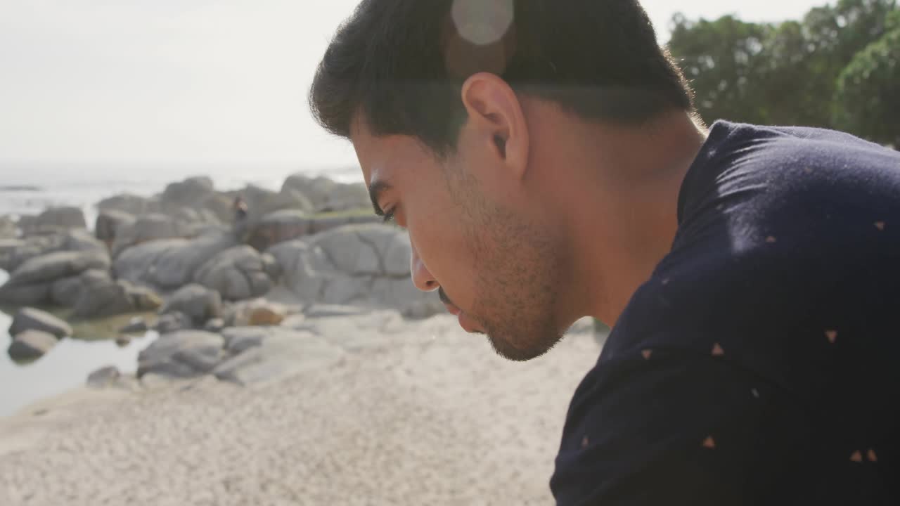 Man leaning over rail gazing at shore causing recycling icon rising forming environmental dashboard