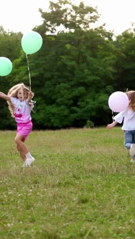 group of happy children playfully running with multicolored balloons