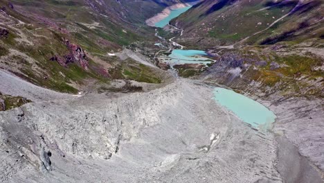 drone flight from moiry glacier towards moiry reservoir and dam in valais switzerland