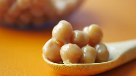 pile of fermented chickpeas on a wooden spoon