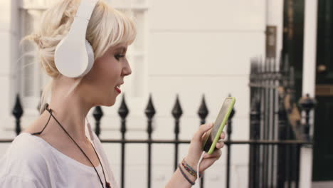 beautiful blonde listening to music in the city