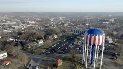 bowling green, kentucky downtown with drone video moving in past water tower