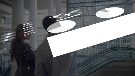 animation of infographic interface over caucasian coworkers discussing blueprint in office