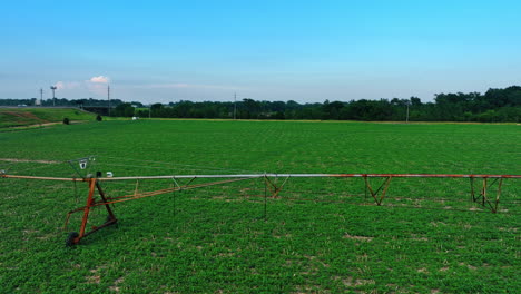 movable metal construction for watering plants on the field. center-pivot-irrigation system on the circular farm.