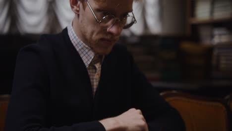 man concentrating on chess game