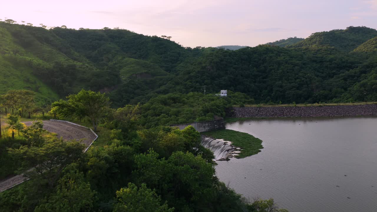 Hillside restaurant on the shores of El Carrizo Dam overflow system in Jalisco, Mexico, dolly in aerial