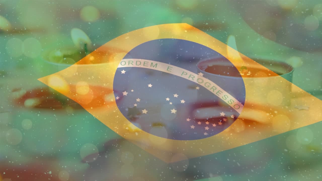 打ち寄せる海の波の上ではためくブラジル国旗のアニメーション