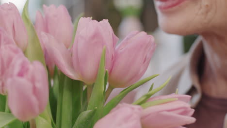 senior woman with pink tulips