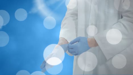 animación de puntos de luz sobre un médico caucásico con guantes médicos