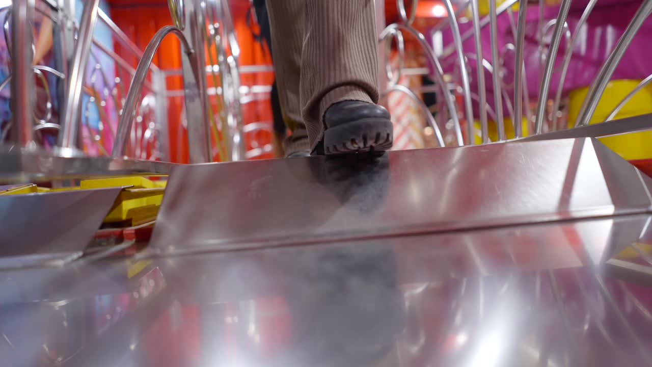 People walking on a funfair ride