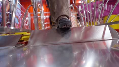 people walking on a funfair ride