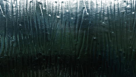 Snow-Falling-Through-Patterned-Frosted-Glass-Window